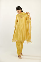 Yellow hand block printed silk chanderi easy fit short kurta set, highlighted with gota flower and scalloped organza at edges.