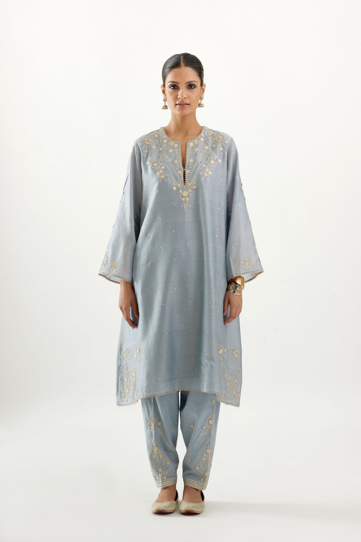 Blue silk chanderi A-line kurta set, highlighted with gold gota flowers and zari embroidery.