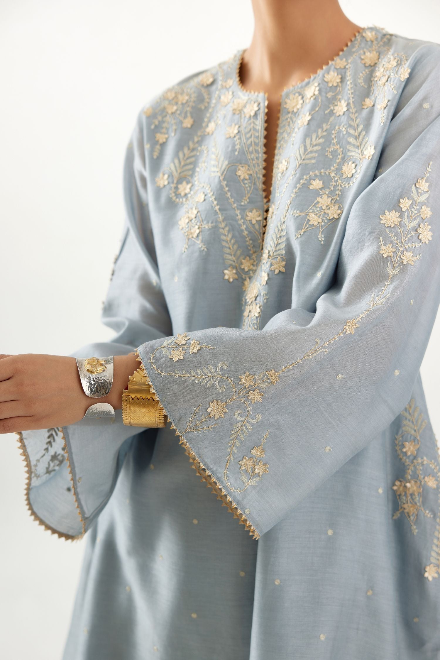 Blue silk chanderi A-line kurta set, highlighted with gold gota flowers and zari embroidery.