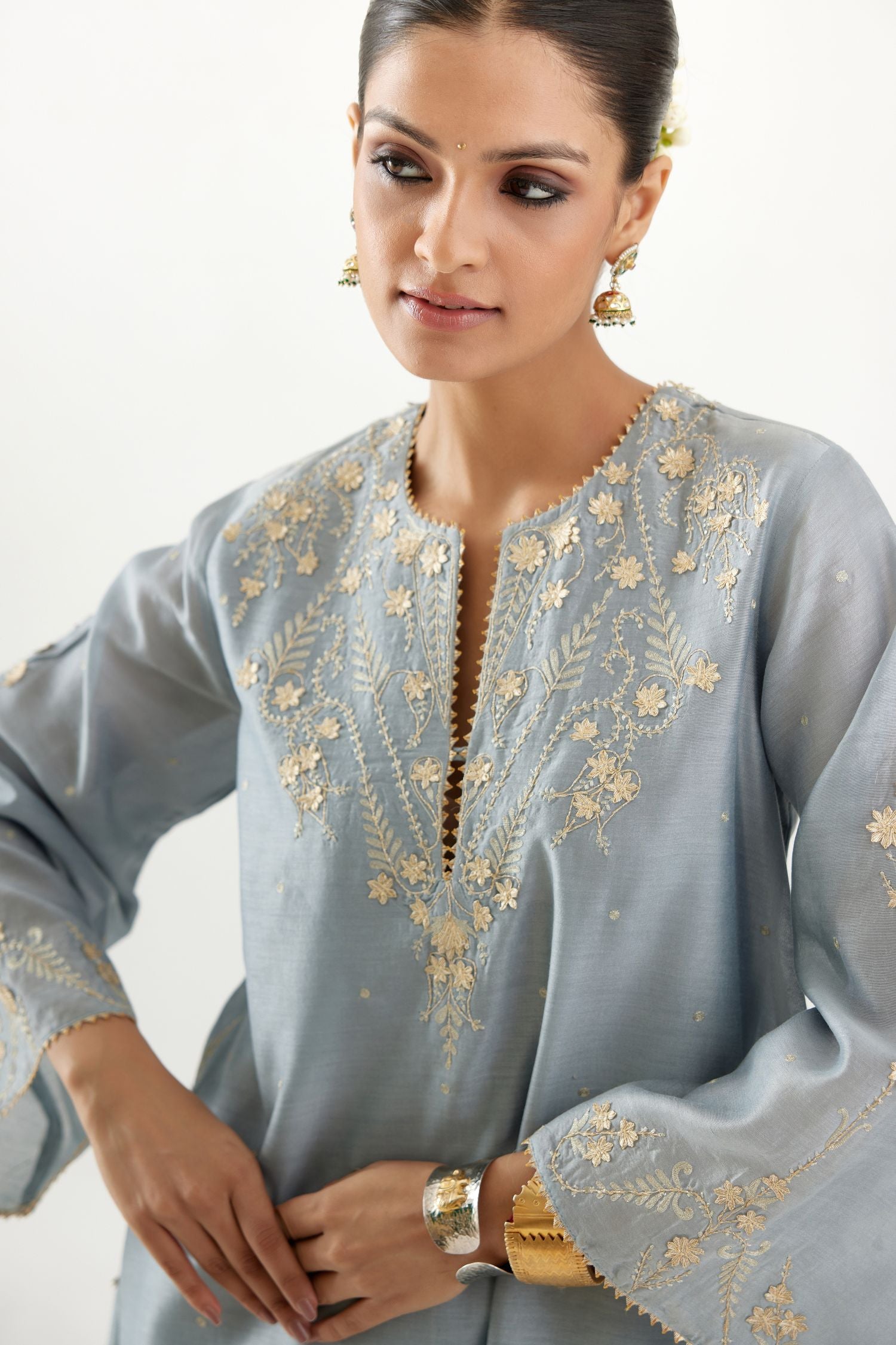Blue silk chanderi A-line kurta set, highlighted with gold gota flowers and zari embroidery.
