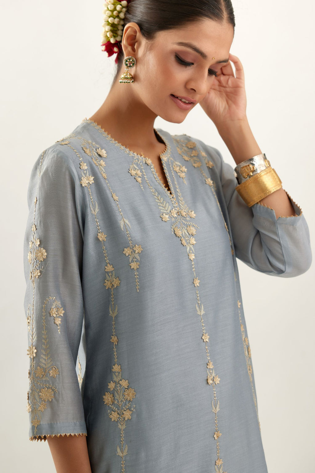 Blue silk chanderi straight kurta set, highlighted with gold zari and gota embroidery.
