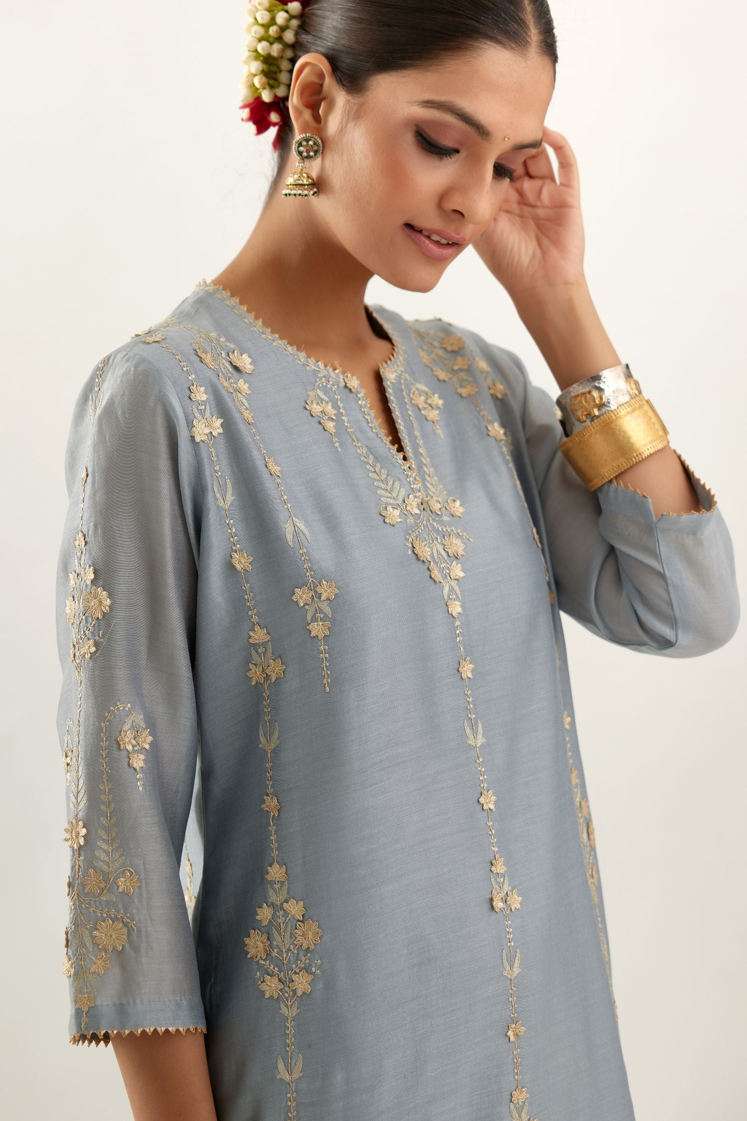 Blue silk chanderi straight kurta set, highlighted with gold zari and gota embroidery.
