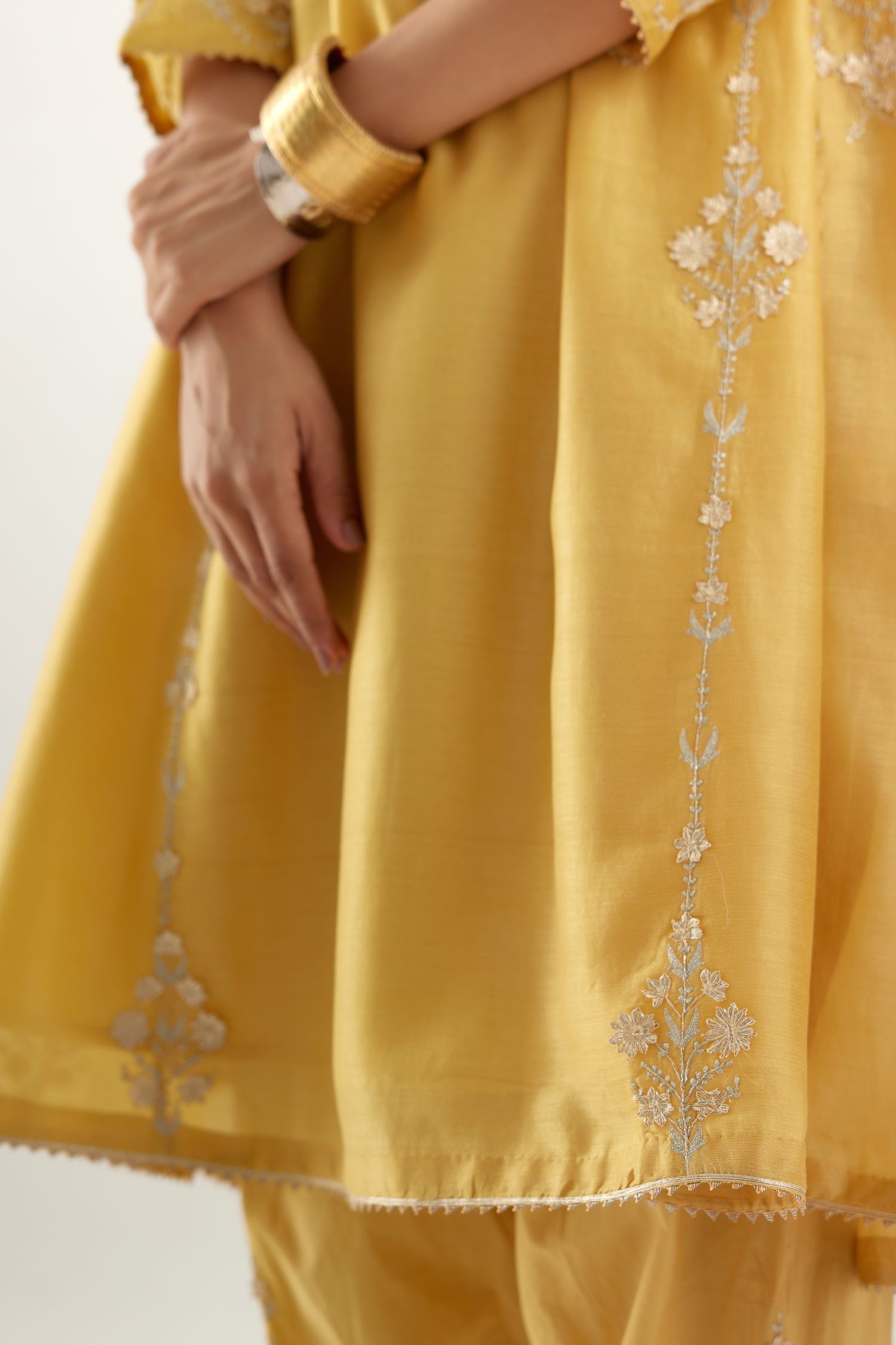 Yellow gold gota and zari embroidered easy fit short kalidar kurta set.