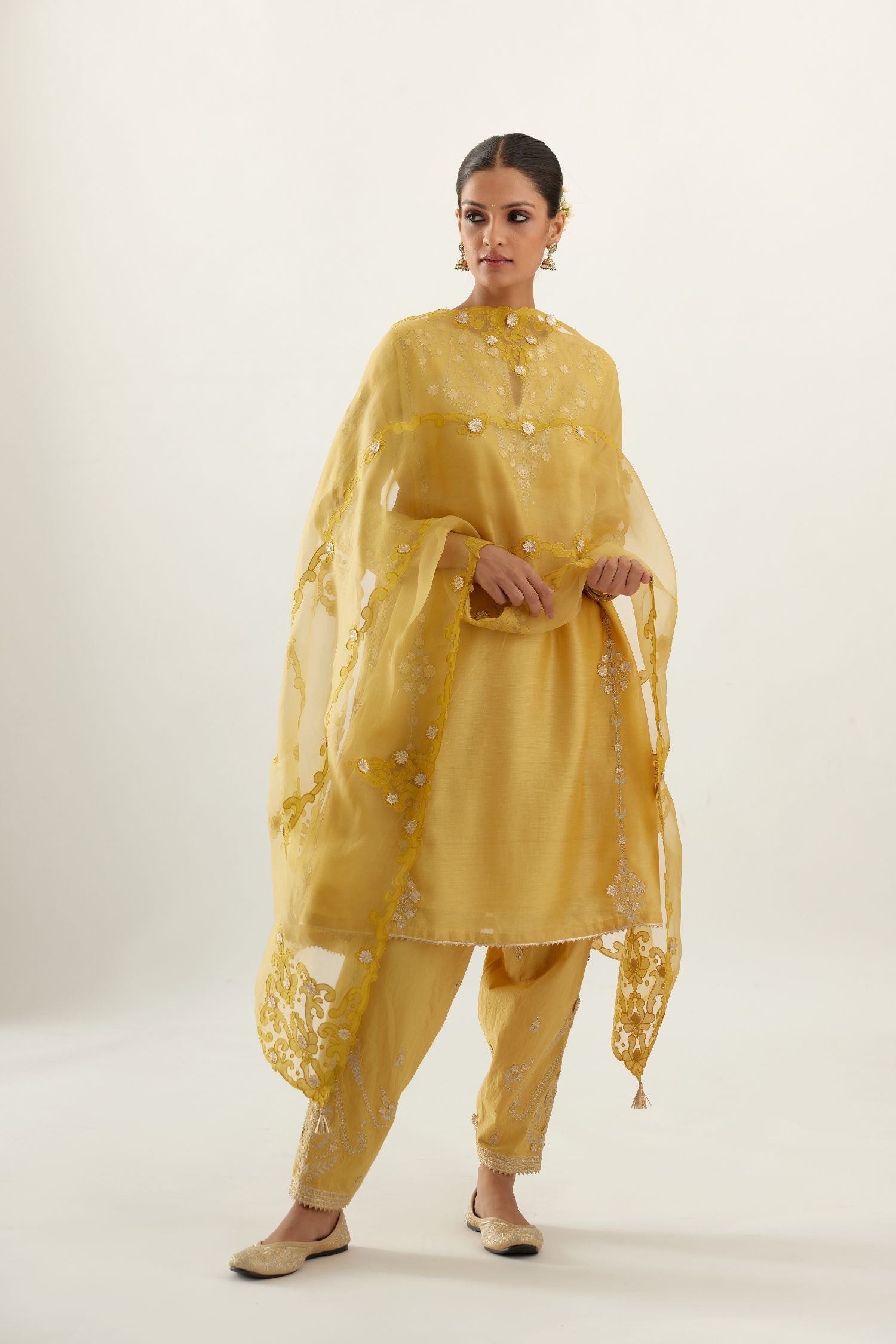 Yellow organza dupatta with heavy silk chanderi appliqué embroidery and gota flower detail.
