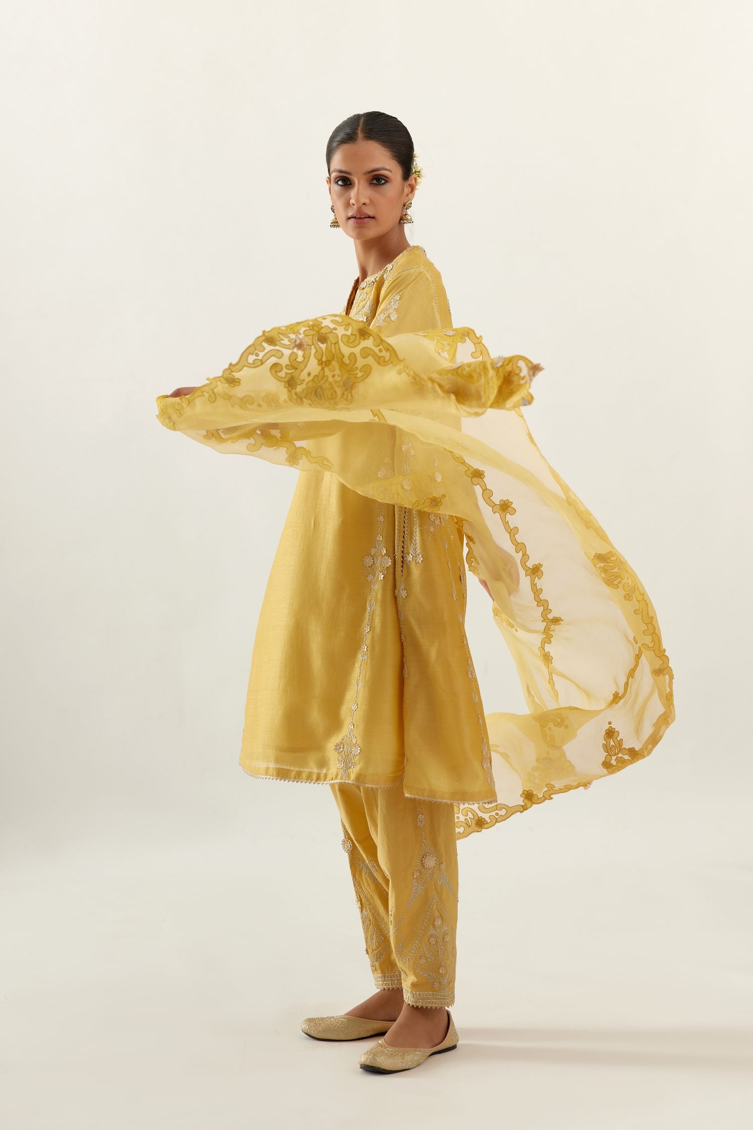 Yellow organza dupatta with heavy silk chanderi appliqué embroidery and gota flower detail.