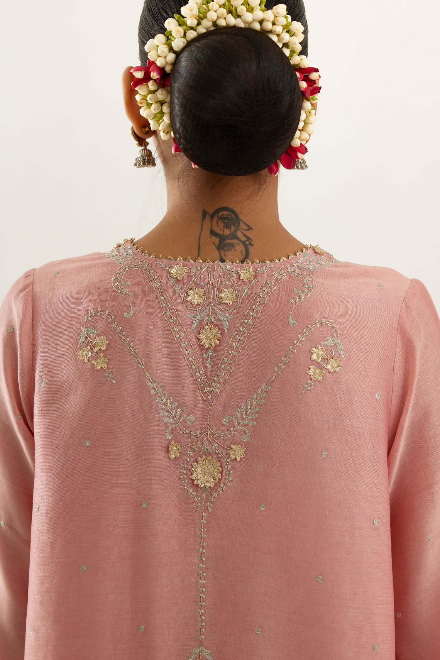 Pink silk chanderi A-line kurta set, highlighted with gold gota flowers and zari embroidery.