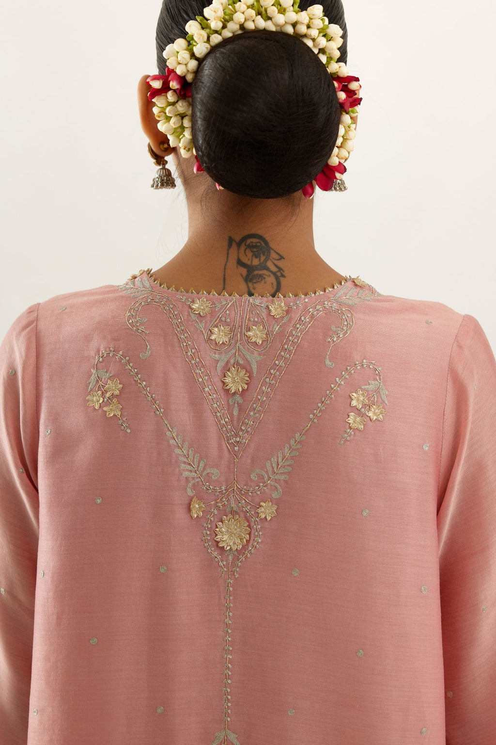 Pink silk chanderi A-line kurta set, highlighted with gold gota flowers and zari embroidery.