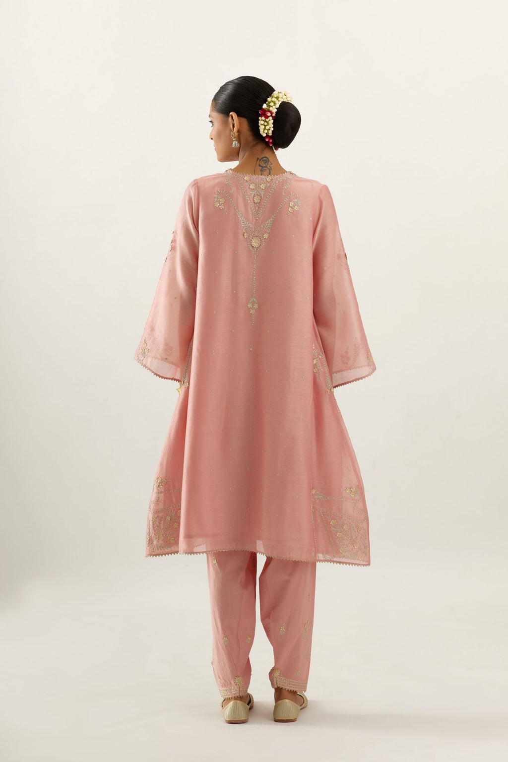 Pink silk chanderi A-line kurta set, highlighted with gold gota flowers and zari embroidery.