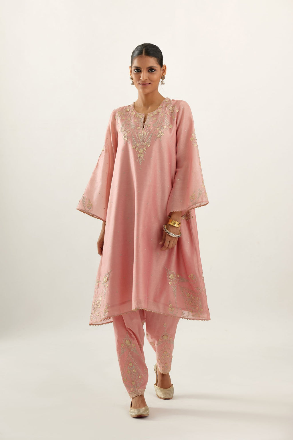 Pink silk chanderi A-line kurta set, highlighted with gold gota flowers and zari embroidery.