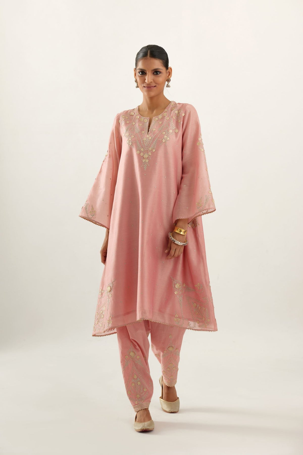 Pink silk chanderi A-line kurta set, highlighted with gold gota flowers and zari embroidery.