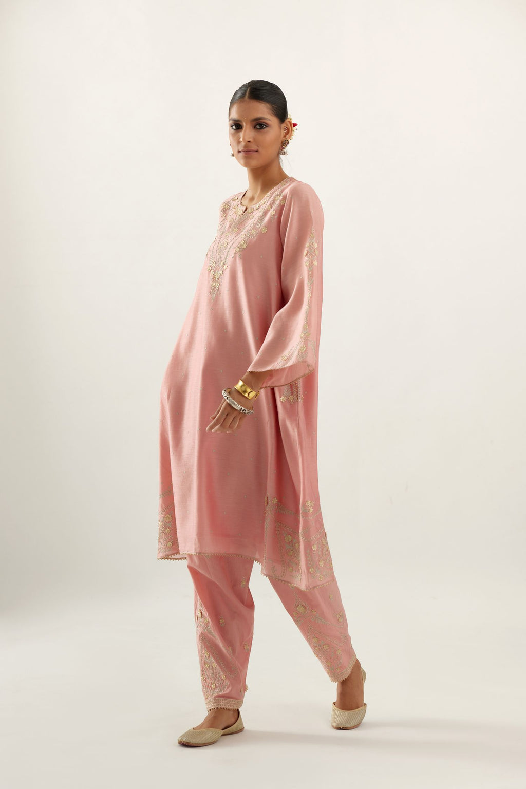 Pink silk chanderi A-line kurta set, highlighted with gold gota flowers and zari embroidery.