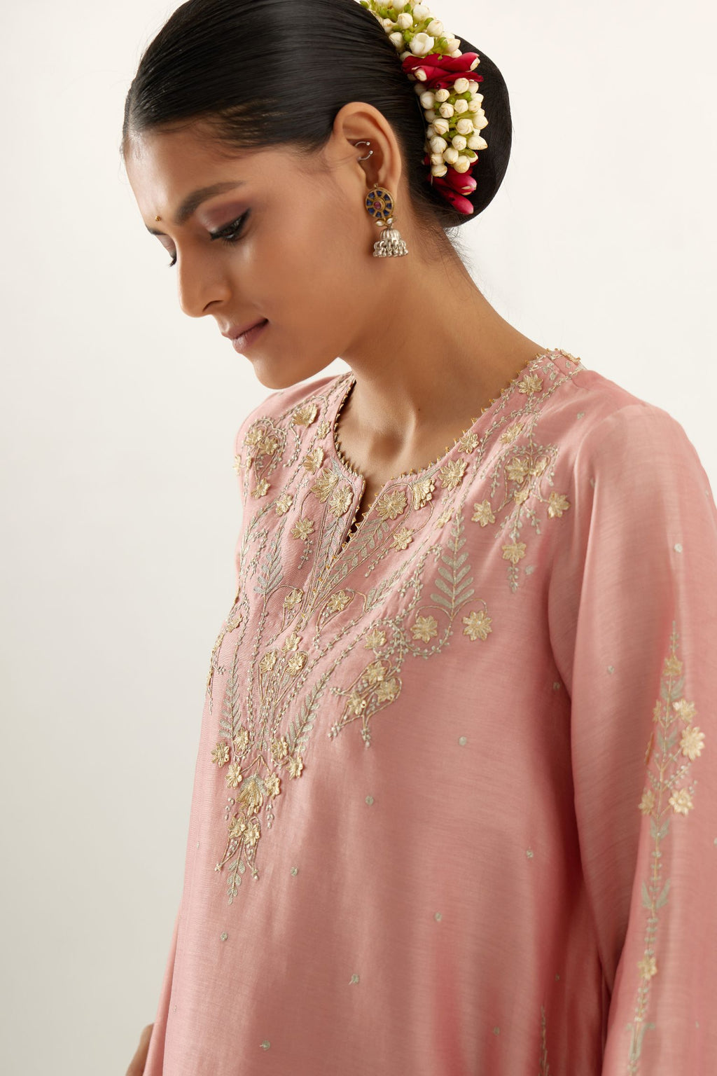 Pink silk chanderi A-line kurta set, highlighted with gold gota flowers and zari embroidery.
