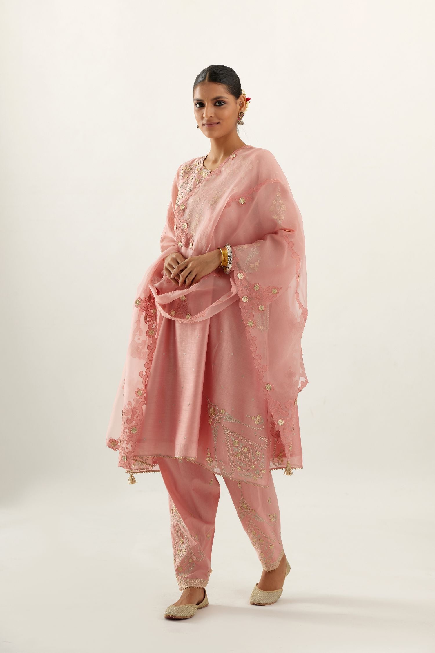Pink silk chanderi A-line kurta set, highlighted with gold gota flowers and zari embroidery.