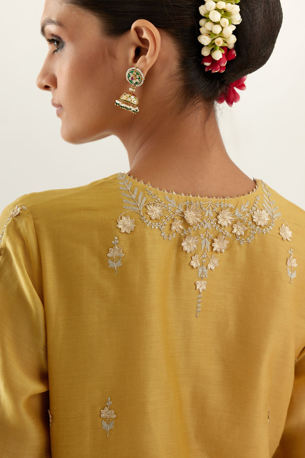 Yellow silk chanderi straight kurta set with button placket neckline, highlighted with all-over gold gota and zari embroidery.