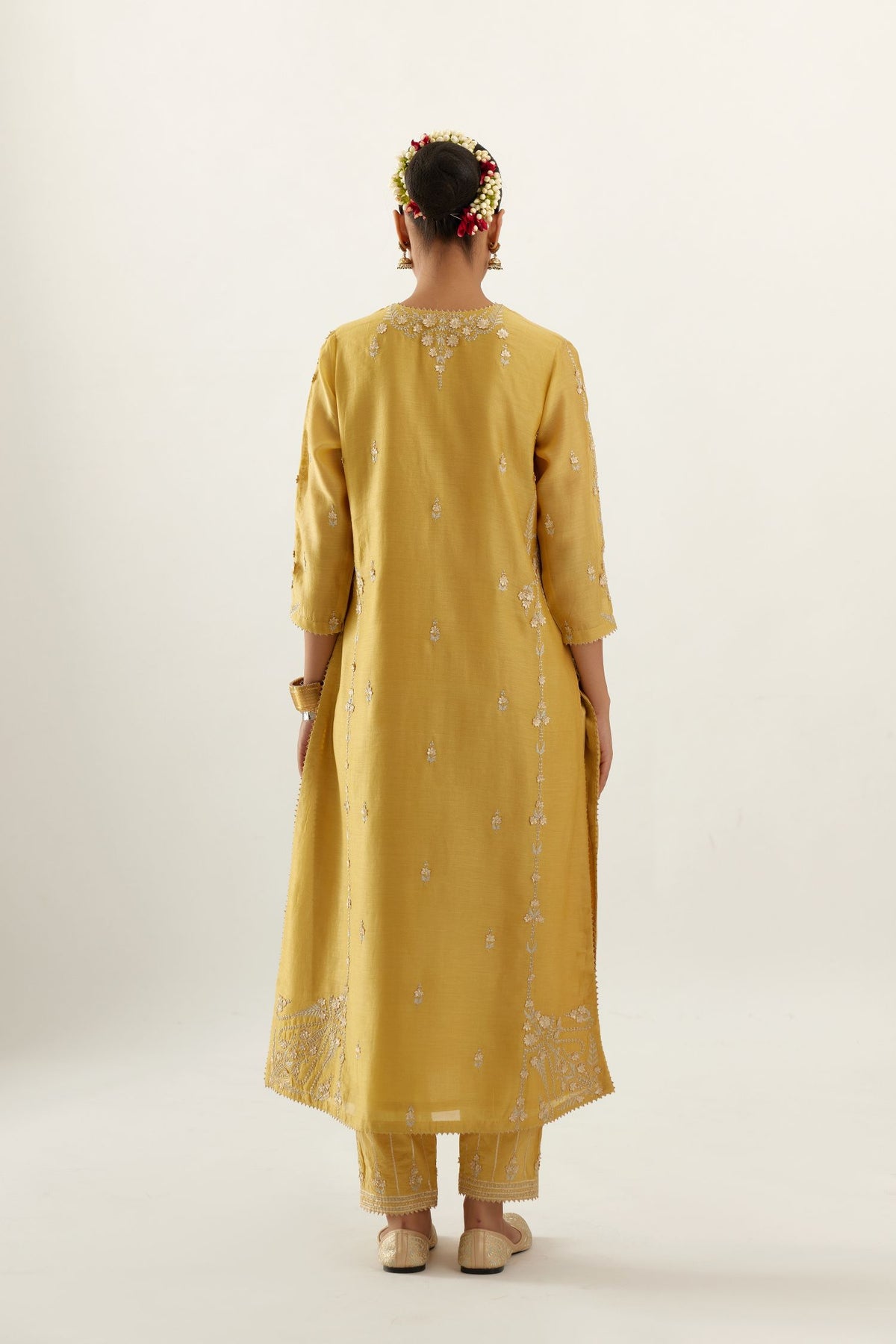 Yellow silk chanderi straight kurta set with button placket neckline, highlighted with all-over gold gota and zari embroidery.