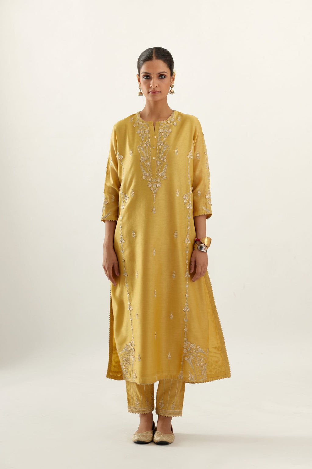 Yellow silk chanderi straight kurta set with button placket neckline, highlighted with all-over gold gota and zari embroidery.