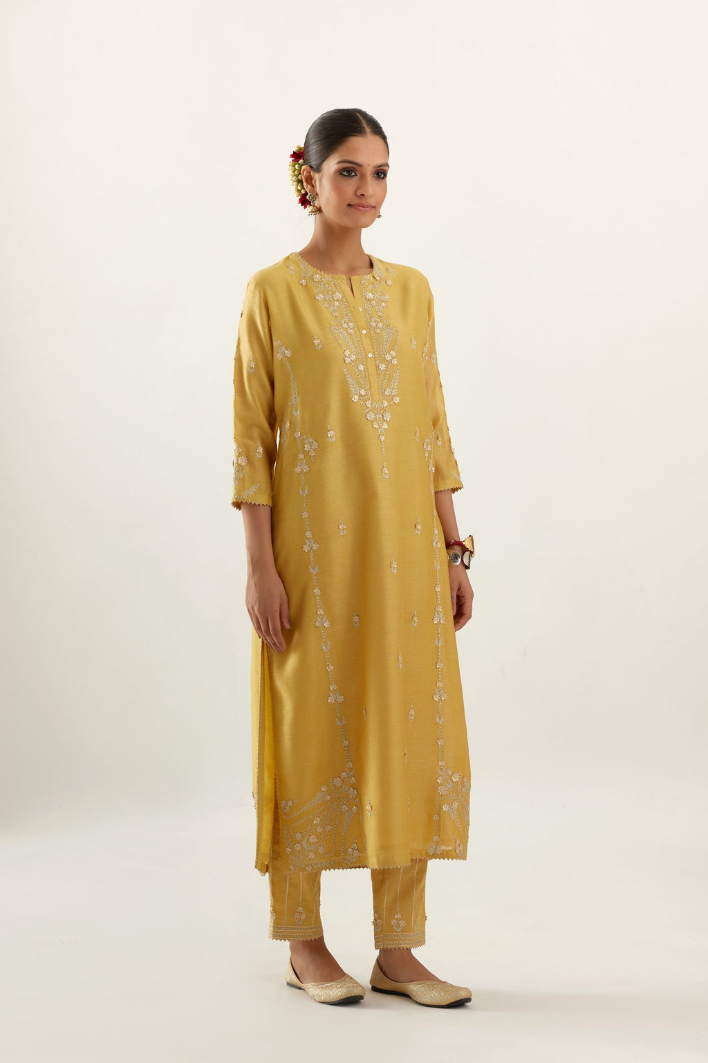 Yellow silk chanderi straight kurta set with button placket neckline, highlighted with all-over gold gota and zari embroidery.