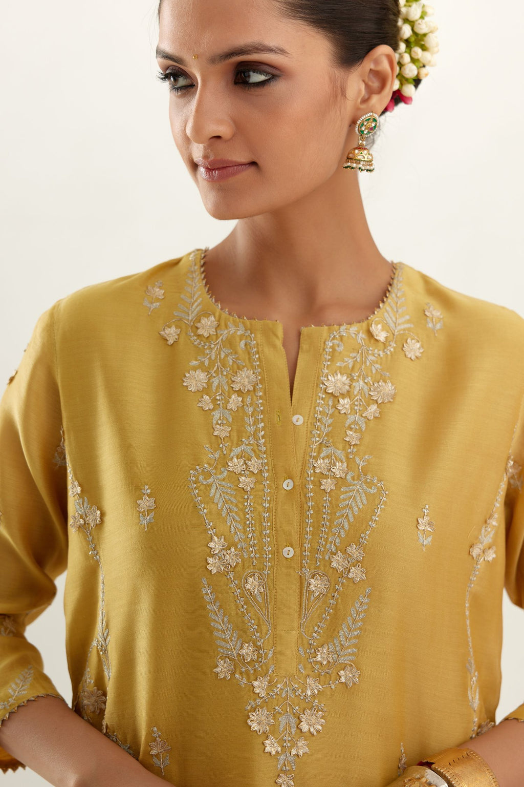 Yellow silk chanderi straight kurta set with button placket neckline, highlighted with all-over gold gota and zari embroidery.