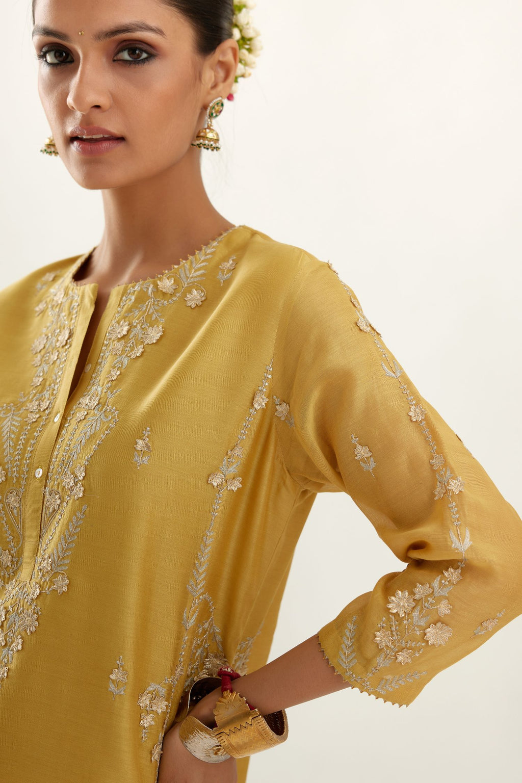 Yellow silk chanderi straight kurta set with button placket neckline, highlighted with all-over gold gota and zari embroidery.