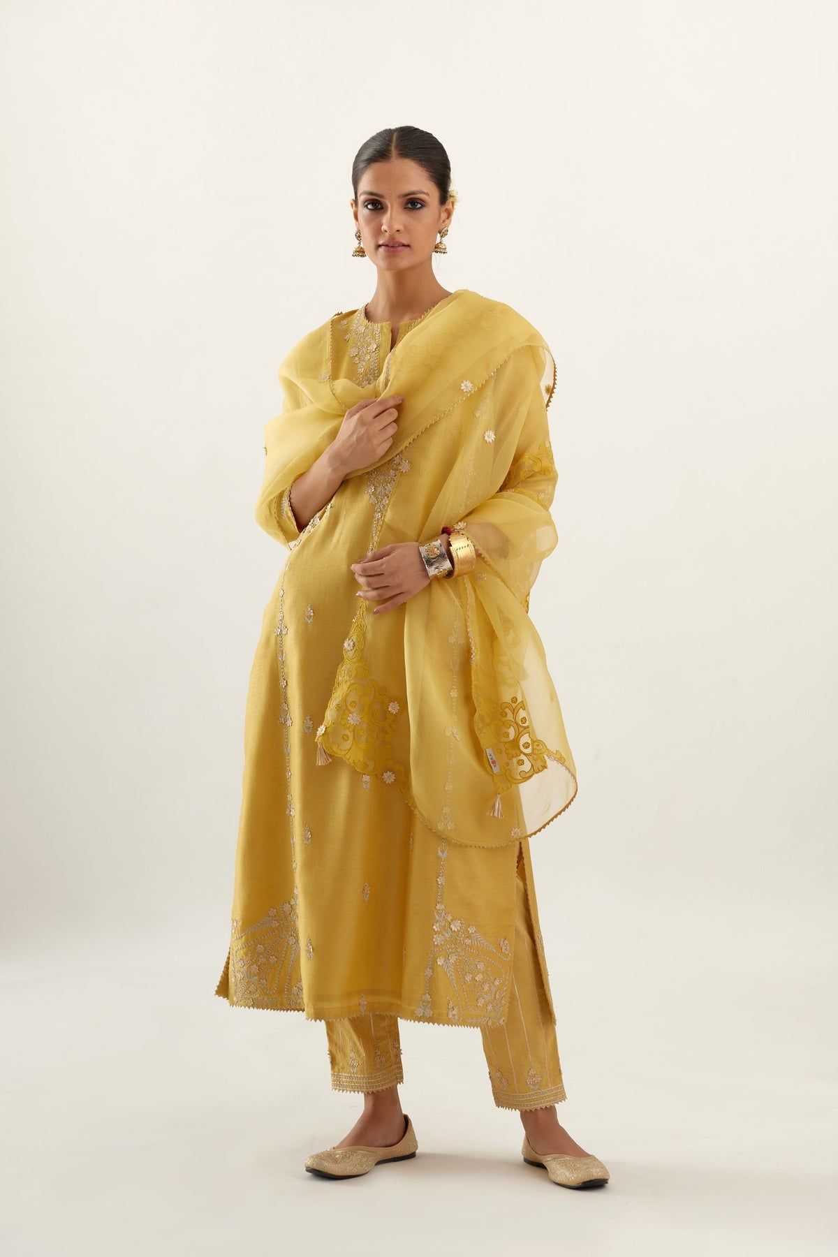 Yellow silk chanderi straight kurta set with button placket neckline, highlighted with all-over gold gota and zari embroidery.