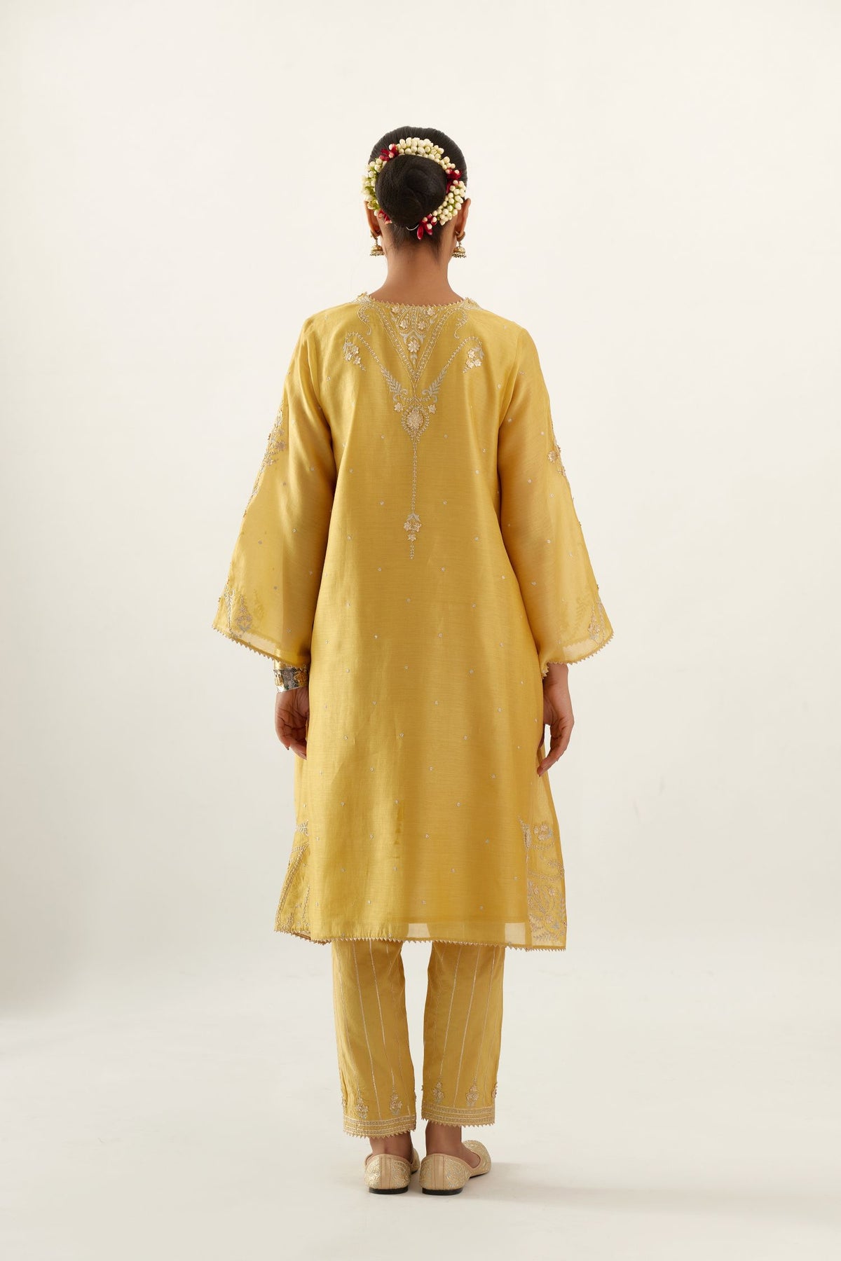Yellow silk chanderi A-line kurta set, highlighted with gold gota flowers and zari embroidery