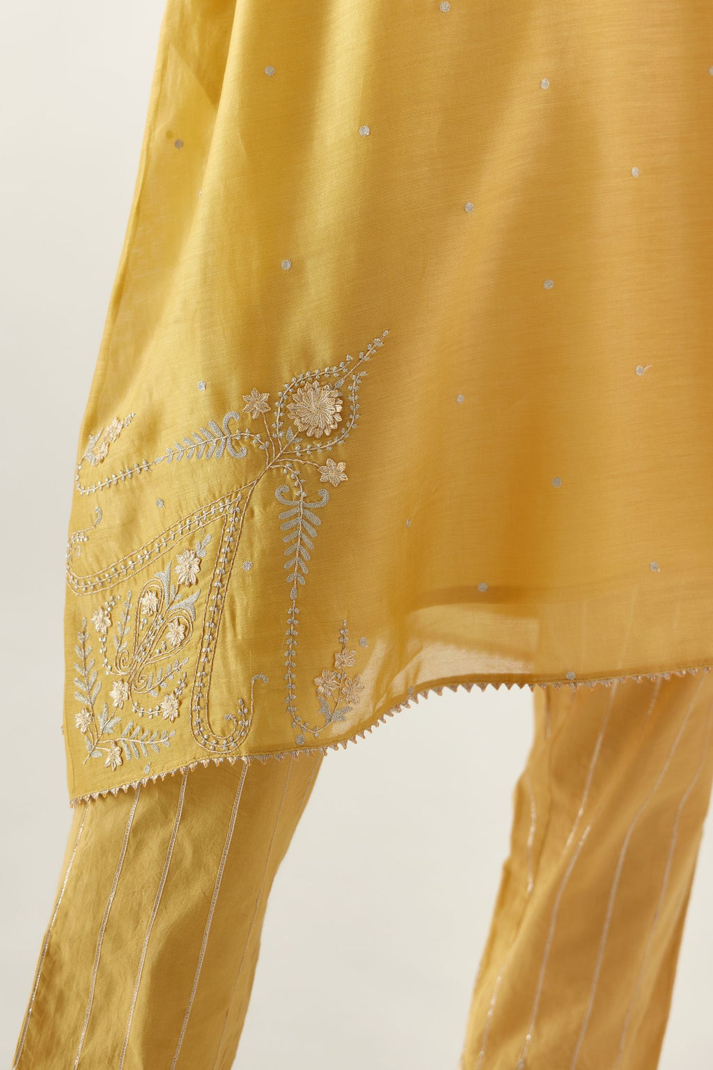 Yellow silk chanderi A-line kurta set, highlighted with gold gota flowers and zari embroidery