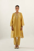 Yellow silk chanderi A-line kurta set, highlighted with gold gota flowers and zari embroidery