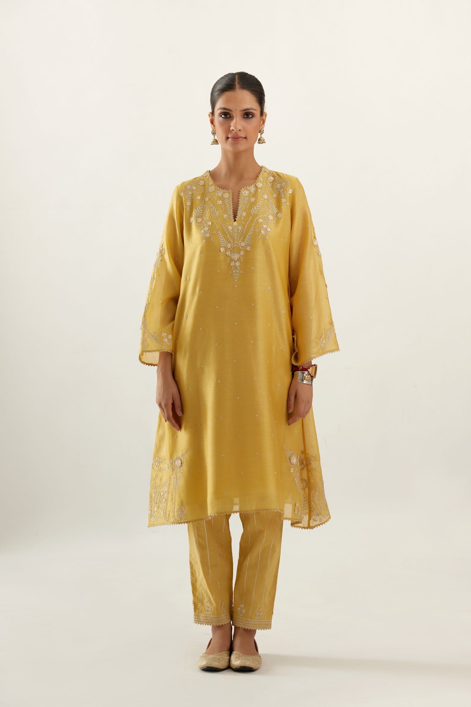 Yellow silk chanderi A-line kurta set, highlighted with gold gota flowers and zari embroidery