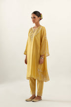 Yellow silk chanderi A-line kurta set, highlighted with gold gota flowers and zari embroidery