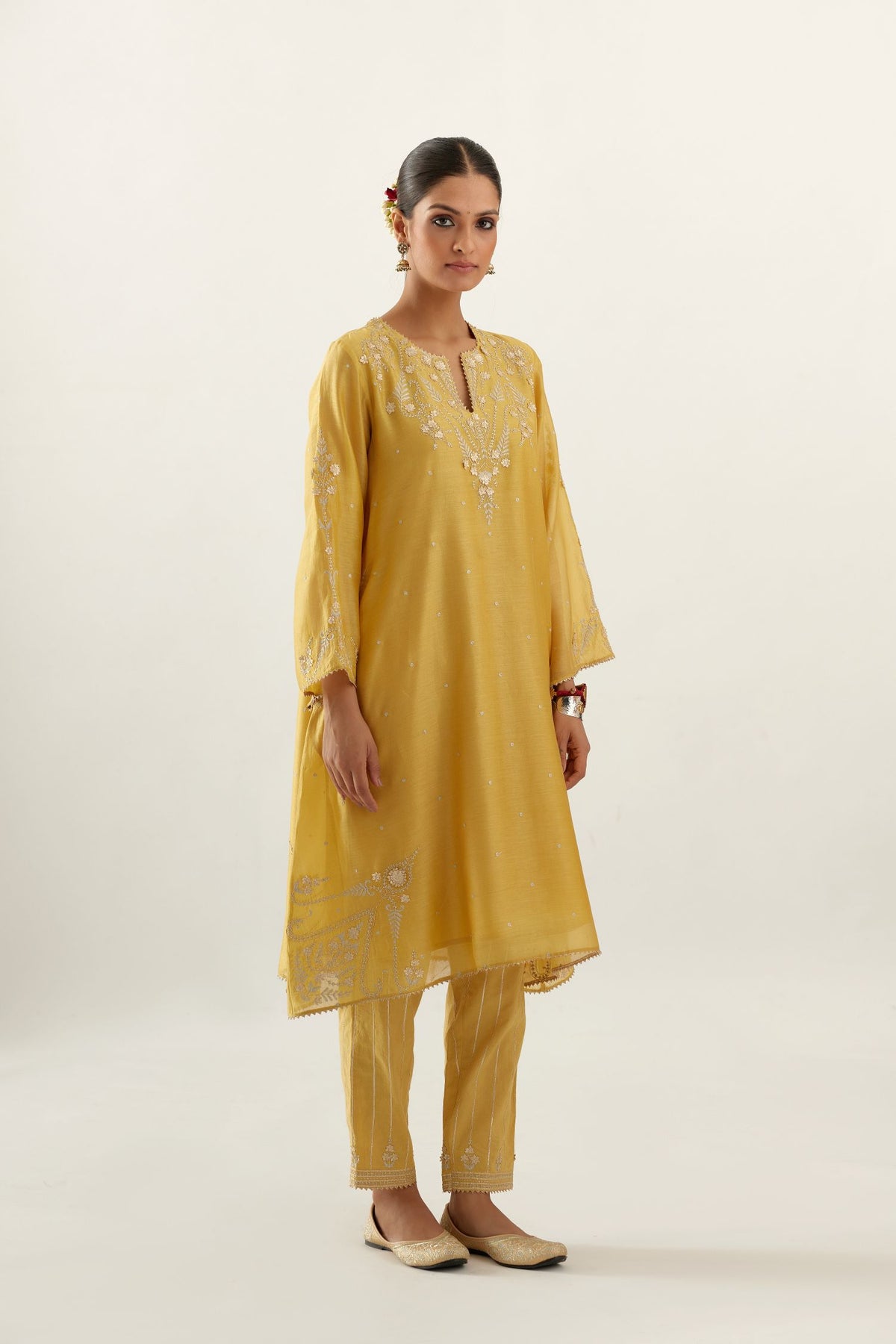 Yellow silk chanderi A-line kurta set, highlighted with gold gota flowers and zari embroidery