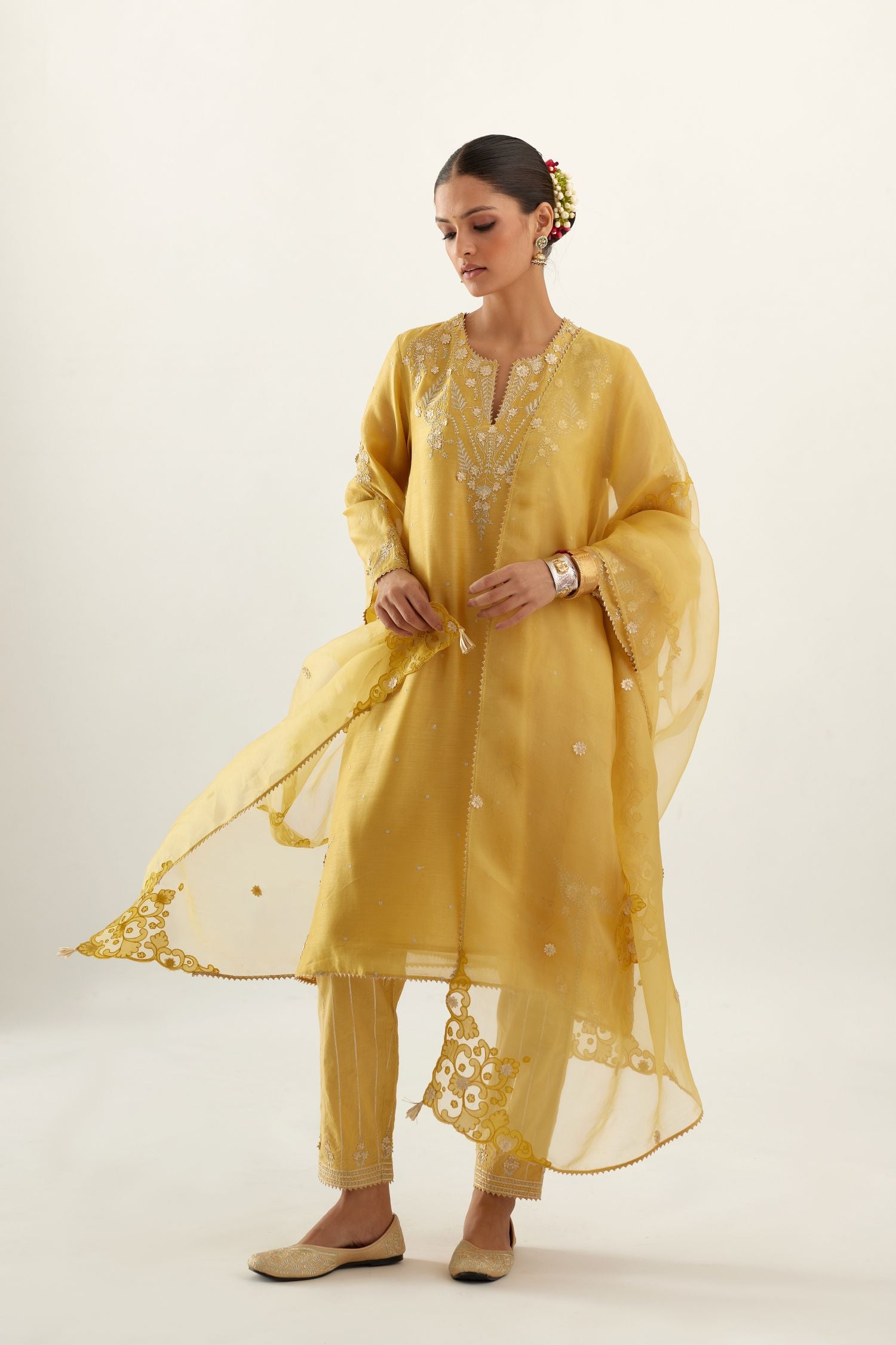 Yellow organza dupatta with silk chanderi appliqué embroidery and gota flower detail.