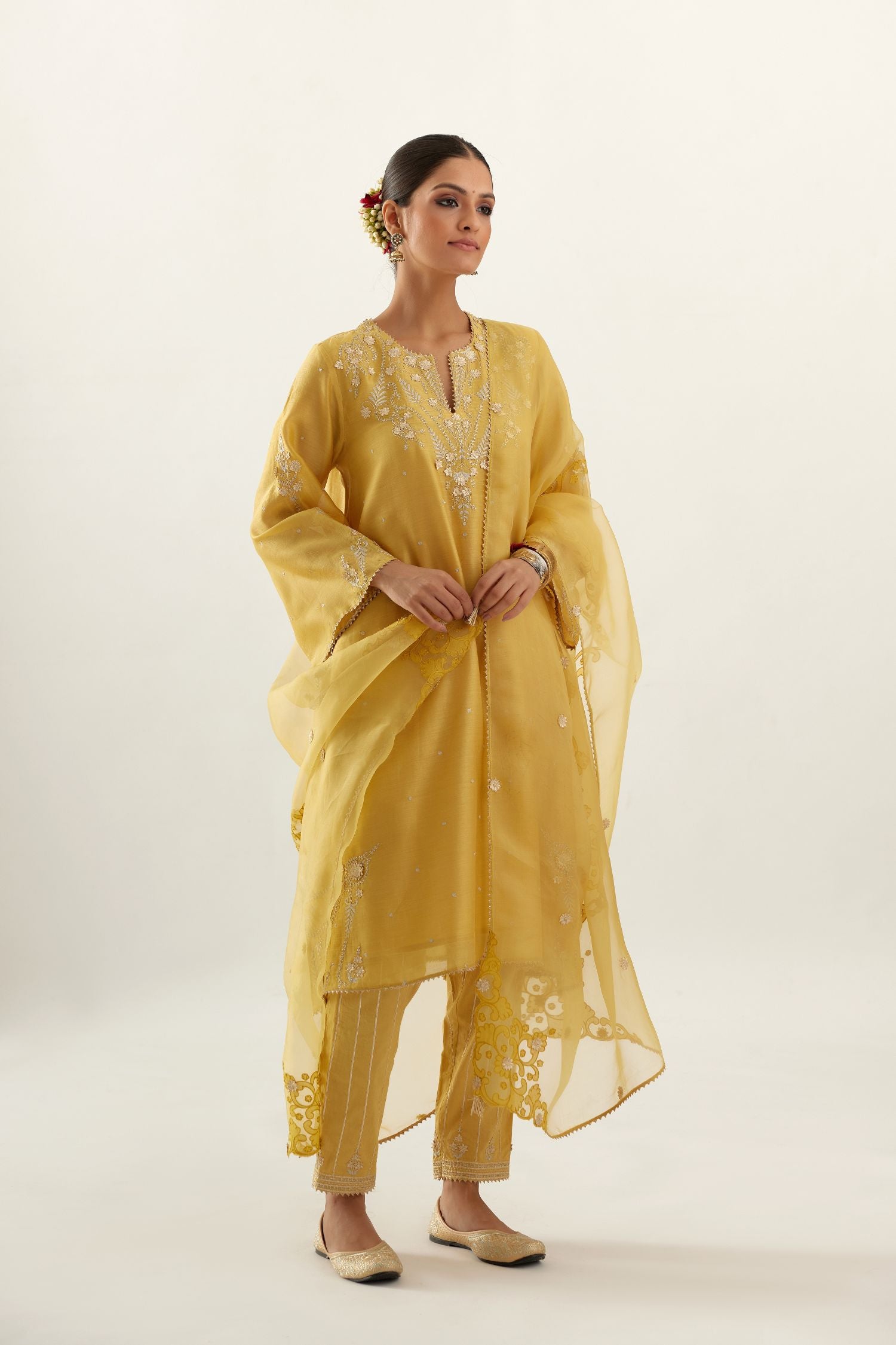Yellow organza dupatta with silk chanderi appliqué embroidery and gota flower detail.