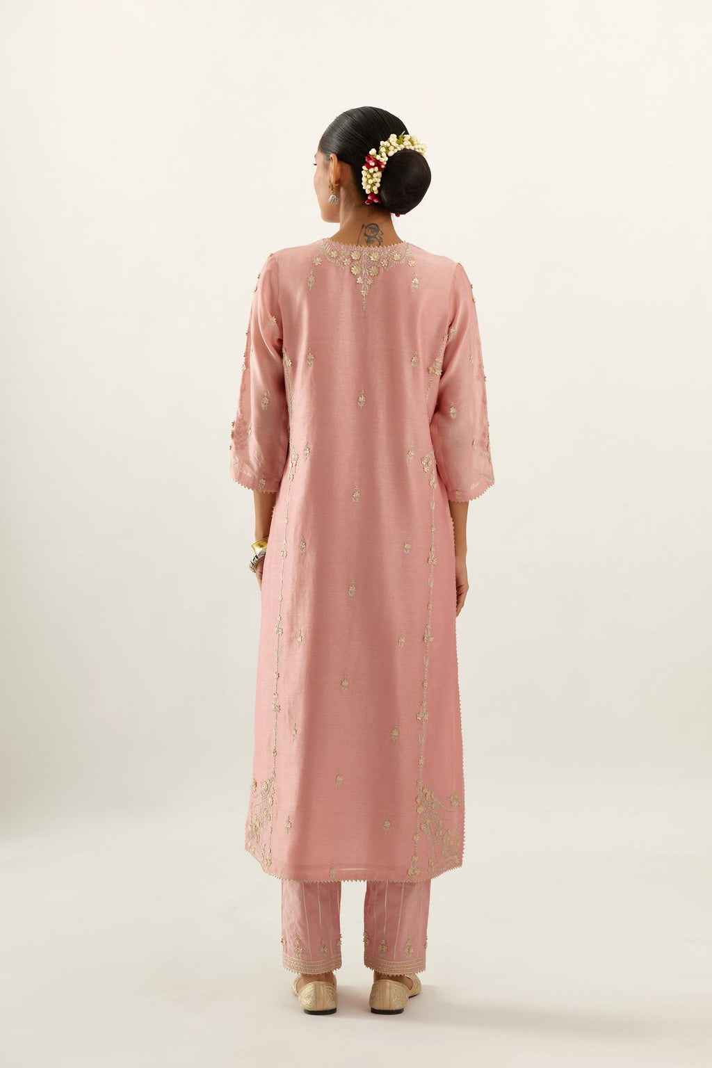 Pink silk chanderi straight kurta set with button placket neckline, highlighted with all-over gold gota and zari embroidery.