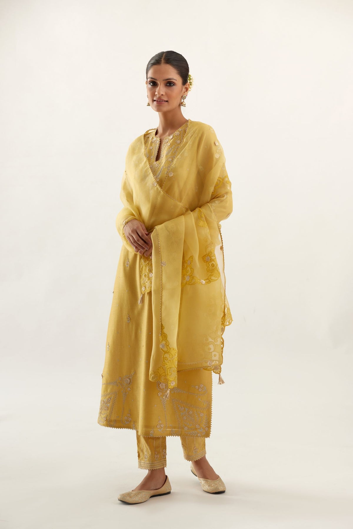 Yellow organza dupatta with silk chanderi appliqué embroidery and gota flower detail.
