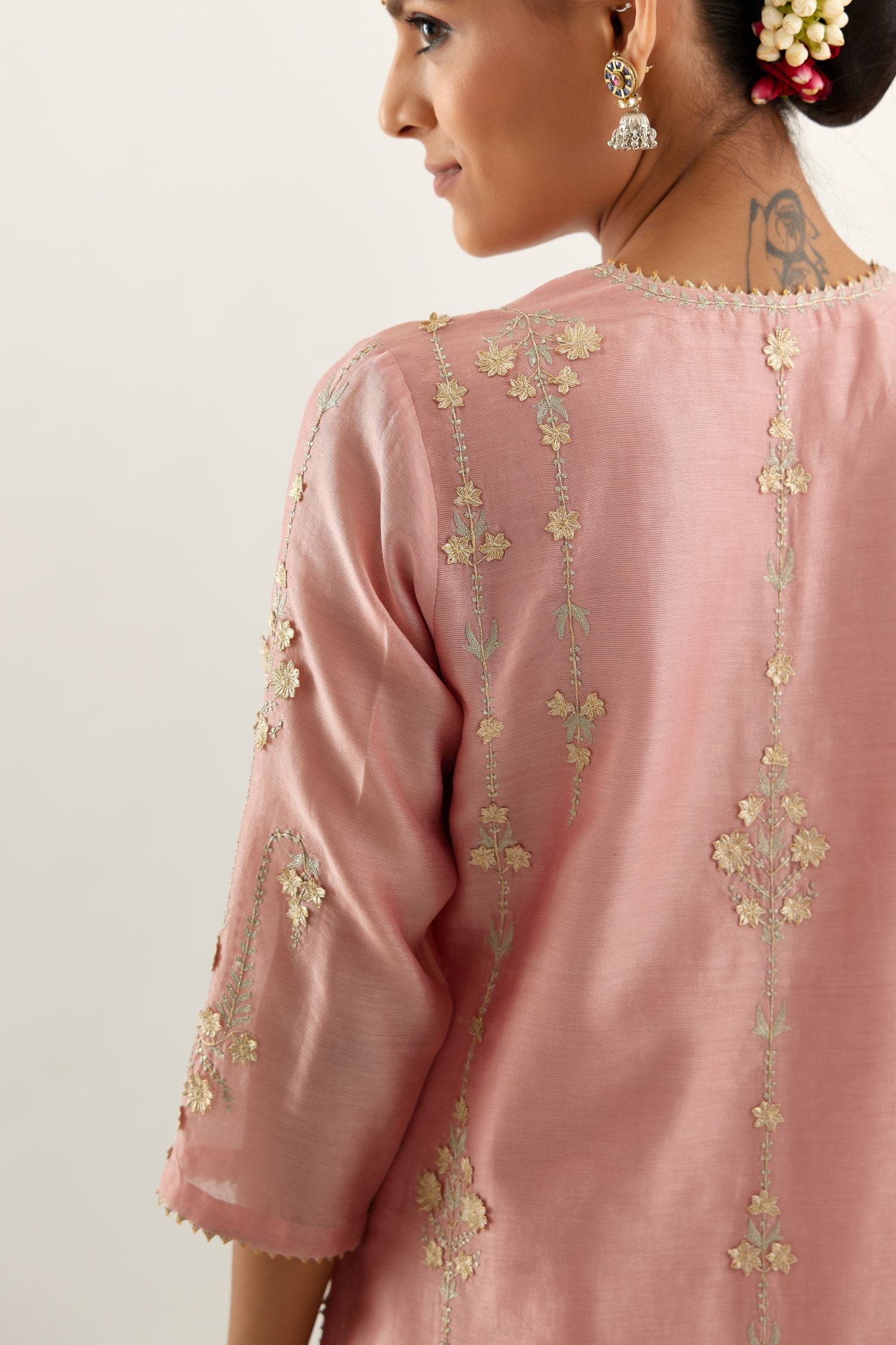 Pink silk chanderi straight kurta set, highlighted with gold zari and gota embroidery.