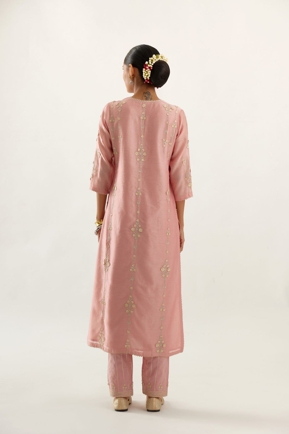 Pink silk chanderi straight kurta set, highlighted with gold zari and gota embroidery.