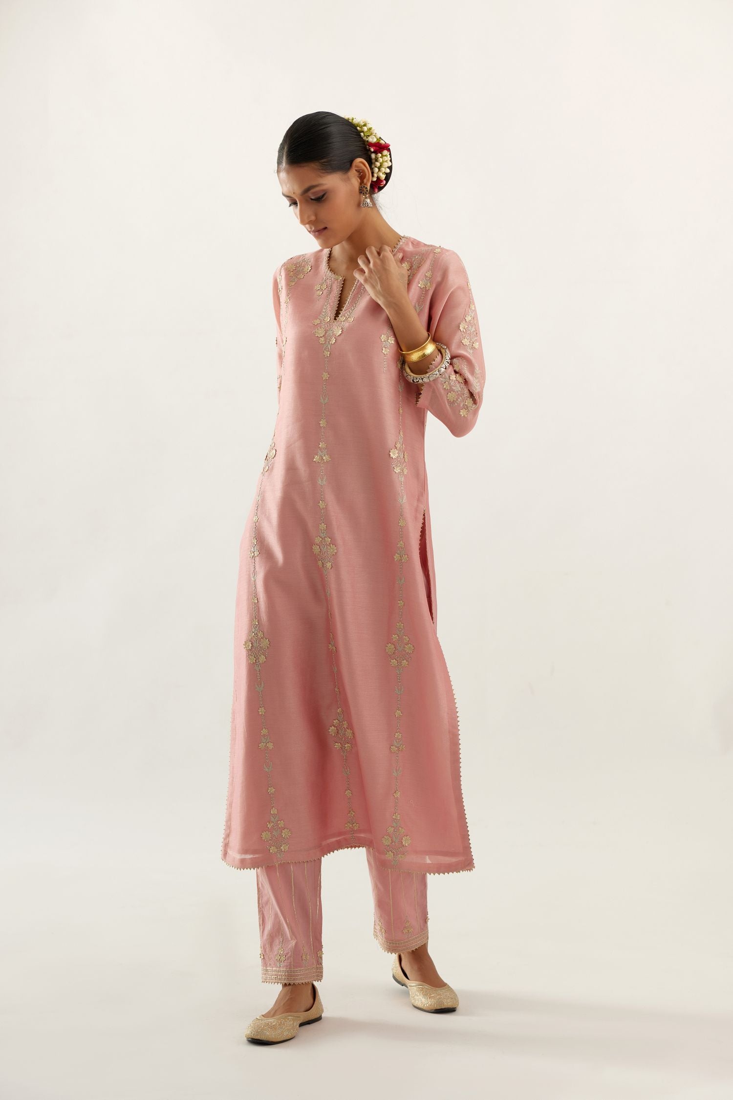 Pink silk chanderi straight kurta set, highlighted with gold zari and gota embroidery.