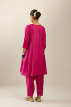 Silk hand crushed short kalidar kurta set with button placket, highlighted with gold sequins and embroidered scalloped organza at edges.