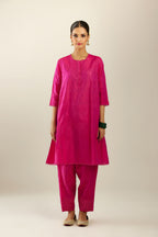 Silk hand crushed short kalidar kurta set with button placket, highlighted with gold sequins and embroidered scalloped organza at edges.