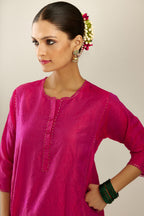 Silk hand crushed short kalidar kurta set with button placket, highlighted with gold sequins and embroidered scalloped organza at edges.