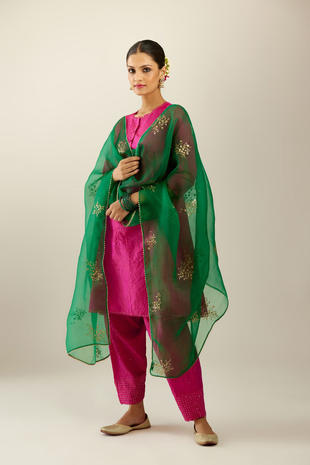 Silk hand crushed short kalidar kurta set with button placket, highlighted with gold sequins and embroidered scalloped organza at edges.
