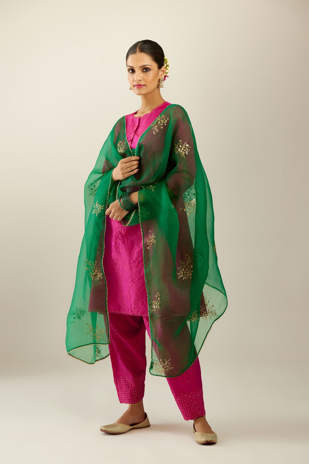 Silk hand crushed short kalidar kurta set with button placket, highlighted with gold sequins and embroidered scalloped organza at edges.