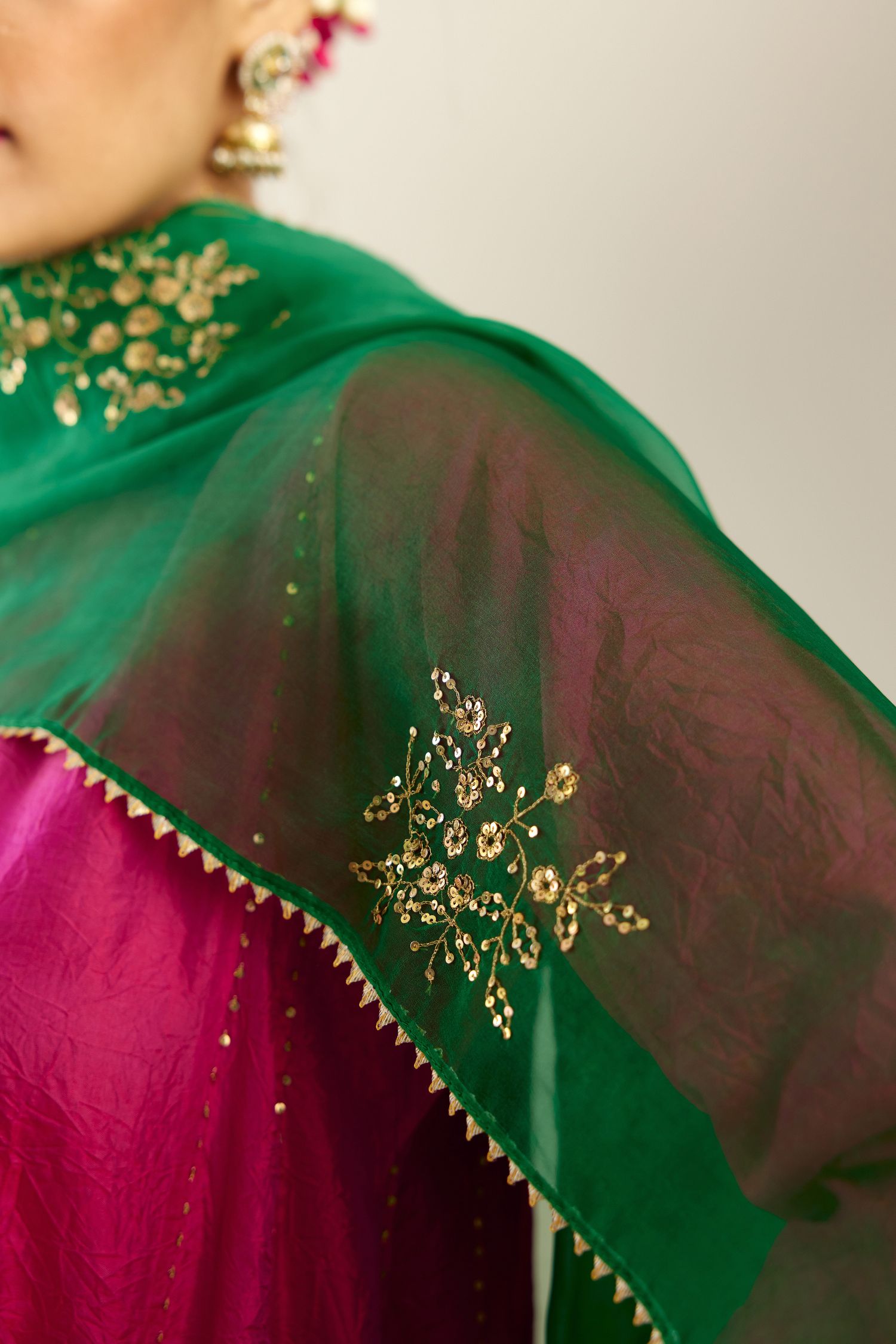 Silk hand crushed short kalidar kurta set with button placket, highlighted with gold sequins and embroidered scalloped organza at edges.