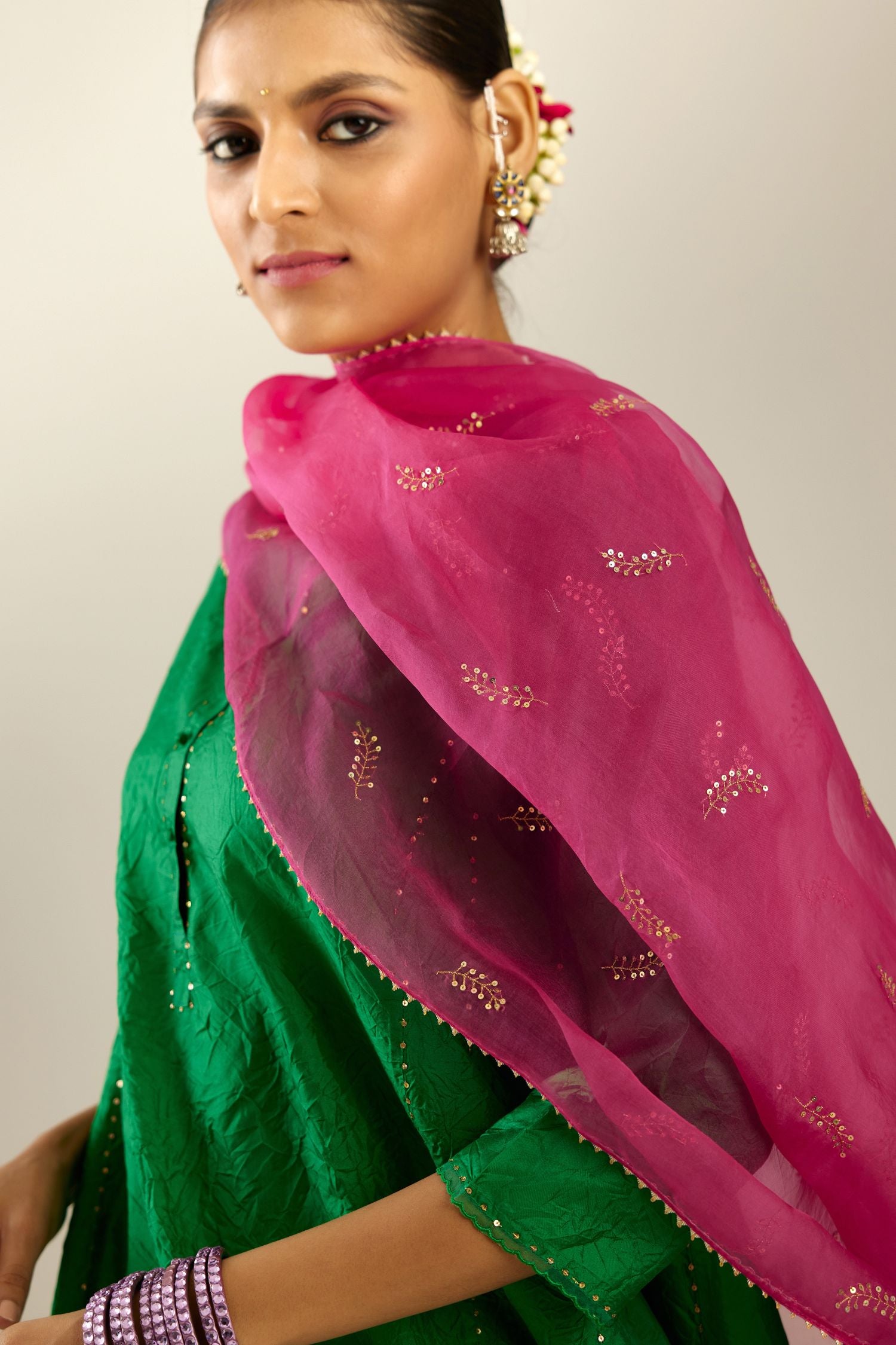 Silk hand crushed short kalidar kurta set with button placket, highlighted with gold sequins and embroidered scalloped organza at edges.