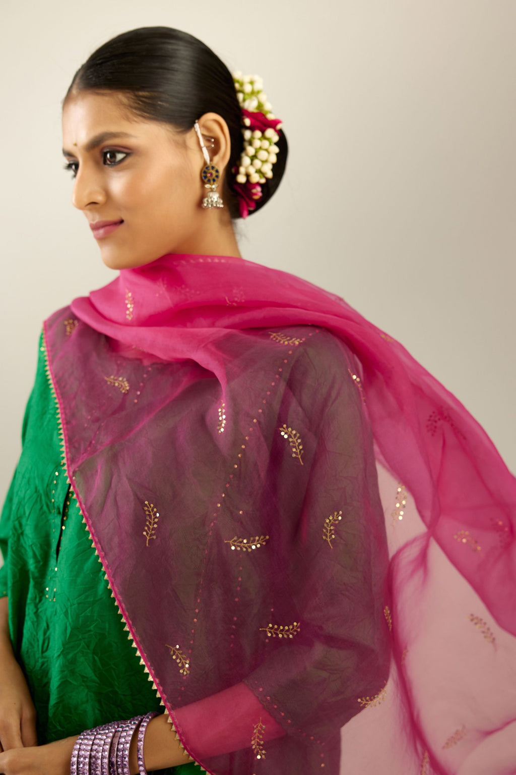 Silk hand crushed short kalidar kurta set with button placket, highlighted with gold sequins and embroidered scalloped organza at edges.