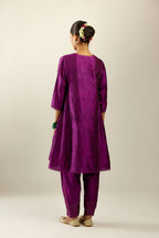 Silk hand crushed short kalidar kurta set with button placket, highlighted with gold sequins and embroidered scalloped organza at edges.