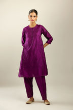 Silk hand crushed short kalidar kurta set with button placket, highlighted with gold sequins and embroidered scalloped organza at edges.