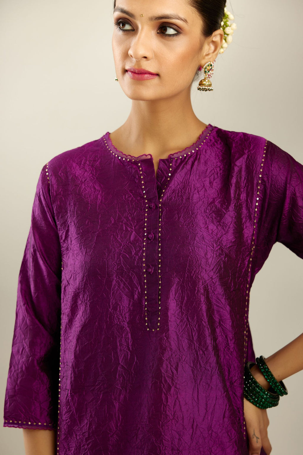 Silk hand crushed short kalidar kurta set with button placket, highlighted with gold sequins and embroidered scalloped organza at edges.