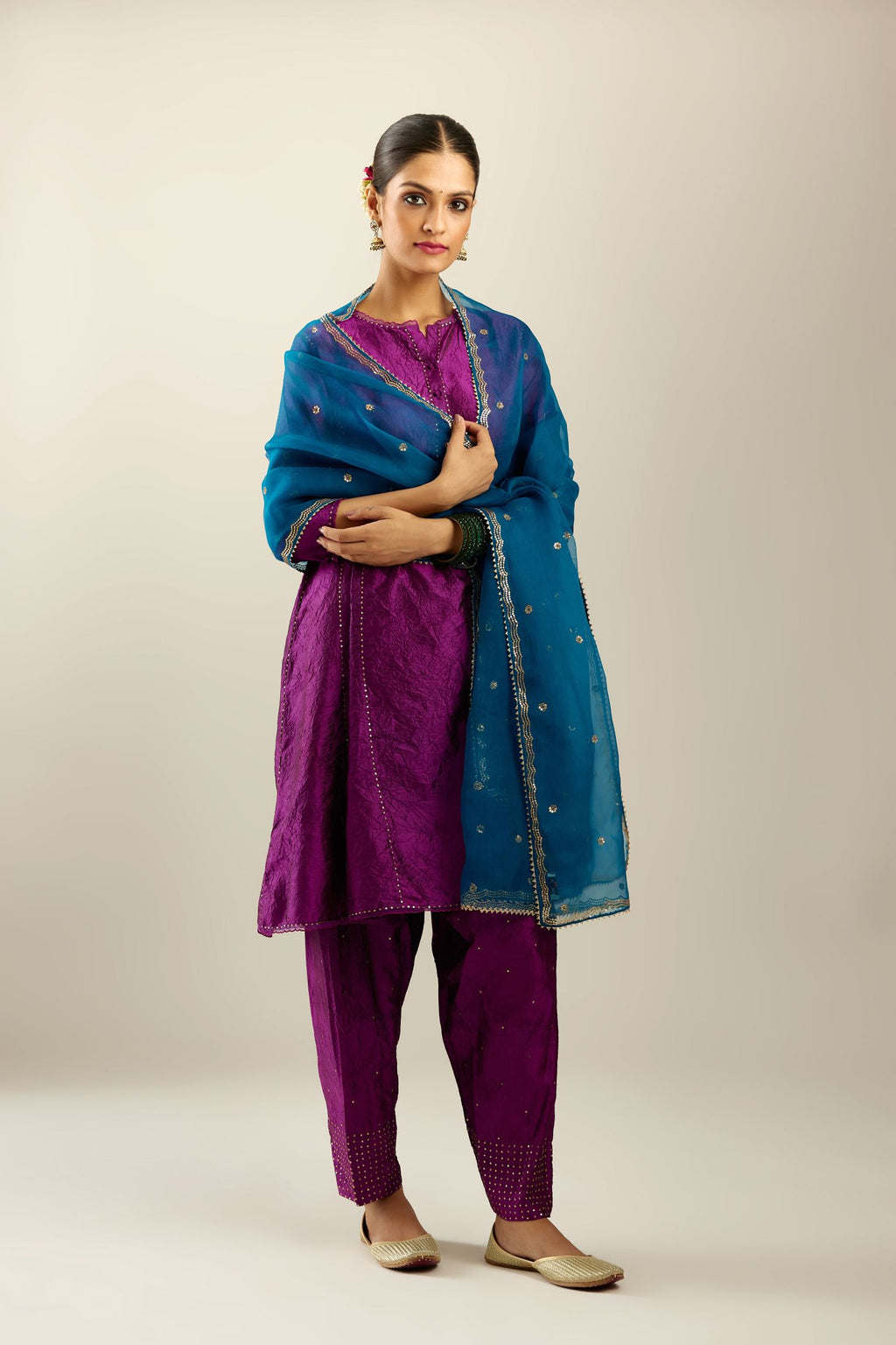 Silk hand crushed short kalidar kurta set with button placket, highlighted with gold sequins and embroidered scalloped organza at edges.