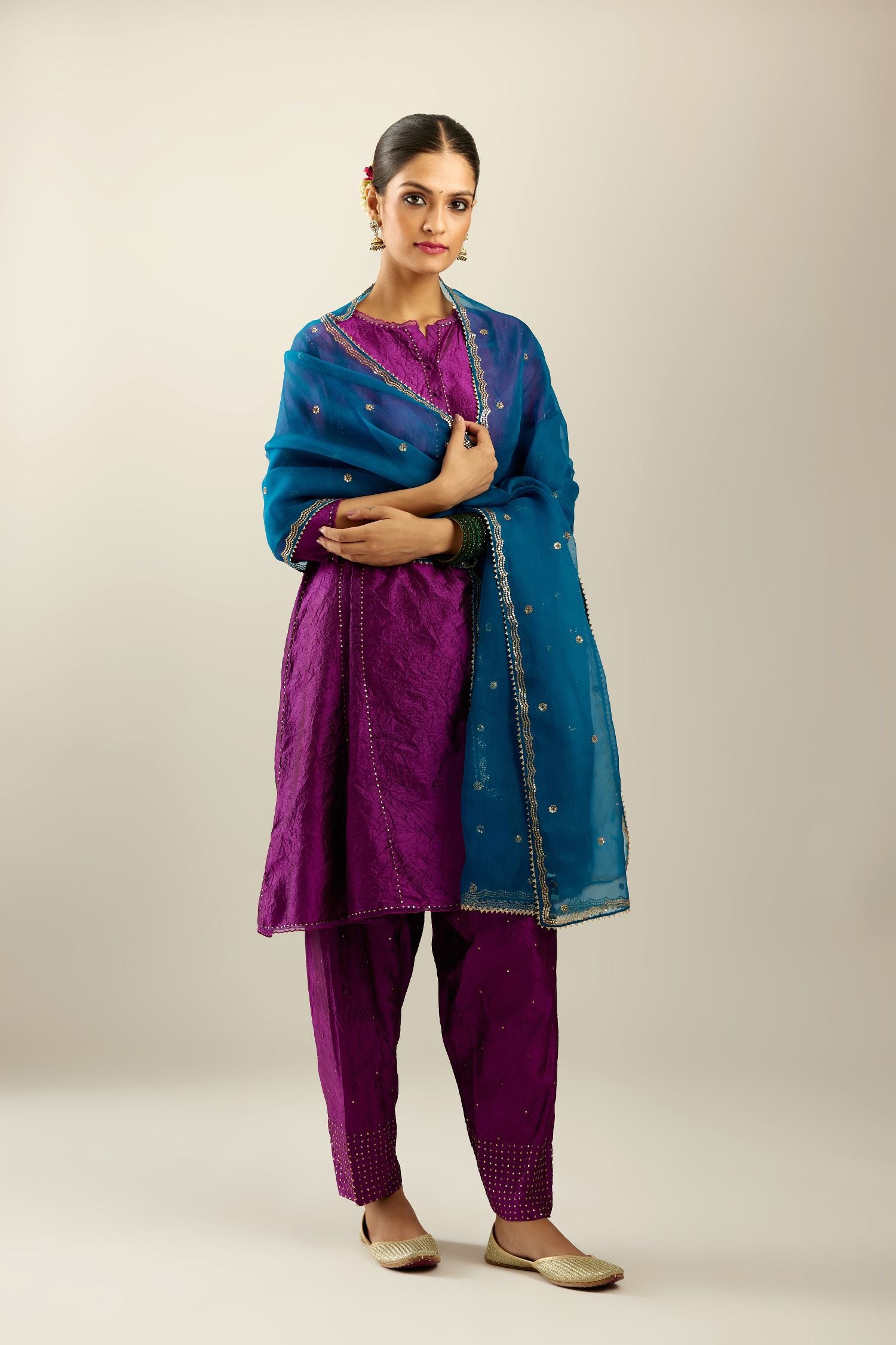 Silk hand crushed short kalidar kurta set with button placket, highlighted with gold sequins and embroidered scalloped organza at edges.